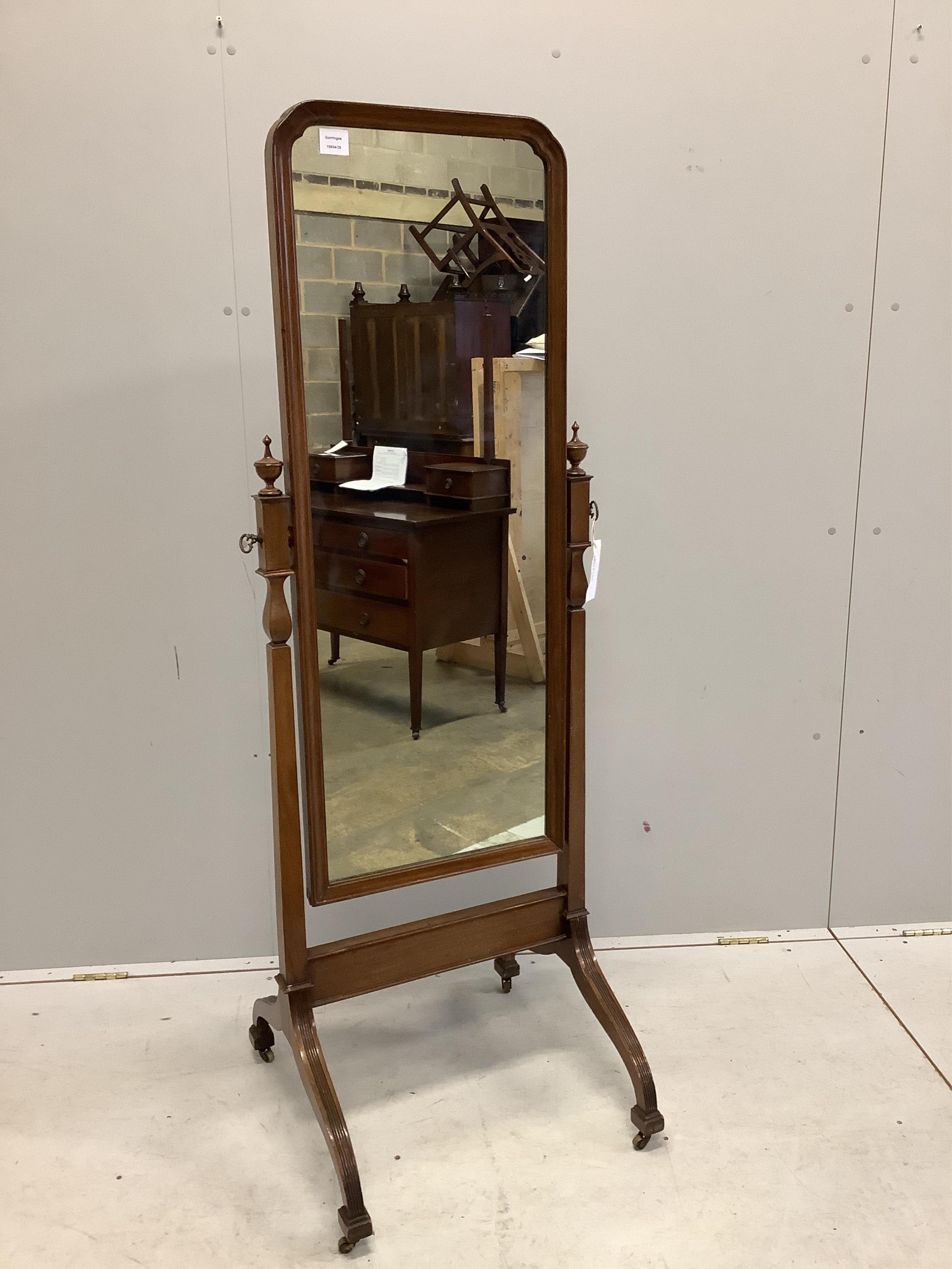 An early 20th century mahogany cheval mirror on fluted down swept feet, width 54cm, height 158cm. Condition - fair to good